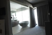 Glass sliding doors from master bed to ensuite